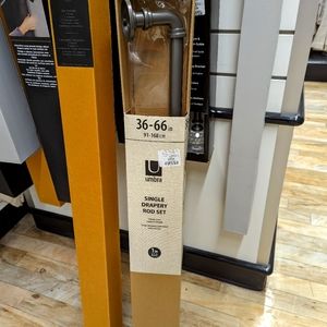 Umbra Curtain rod in a grey brushed metal finish